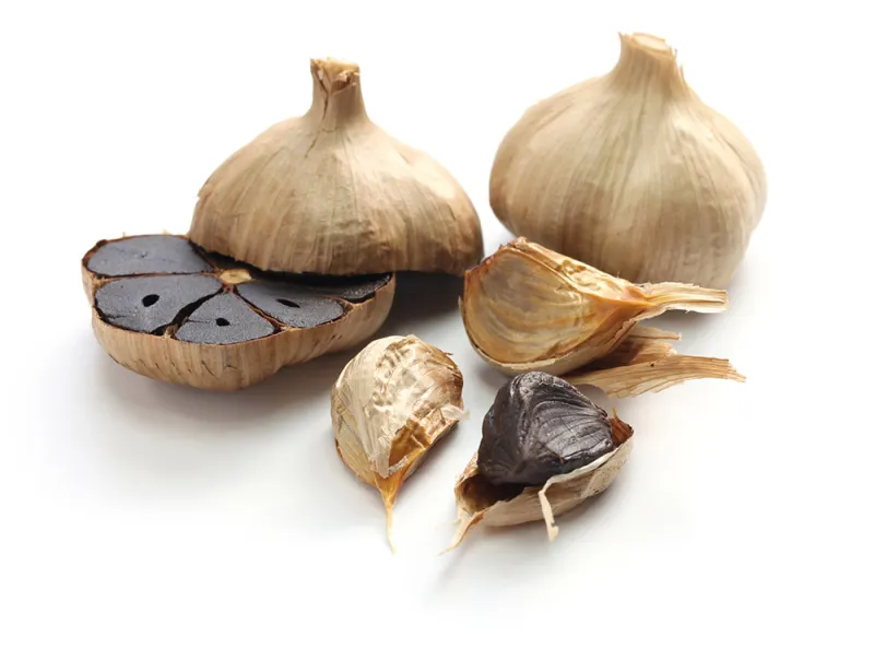 Black garlic bulbs and cloves.