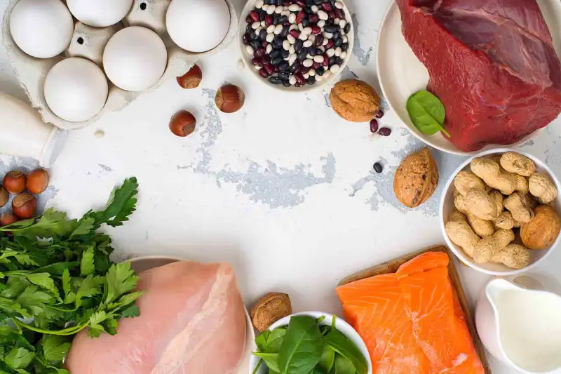Variety of high-protein foods on a table.